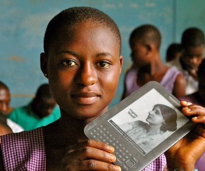 Girl in Ghana Africa with WorldReader Amazon Kindle