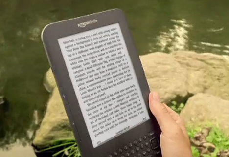 Kindle screen in TV ad by stream reading Ralph Ellison ebook Invisible Man